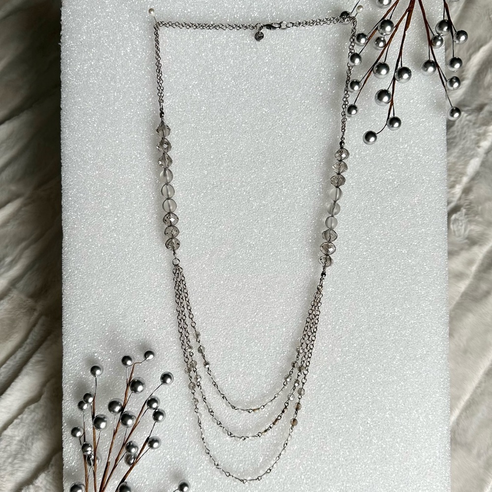Silver tone & faceted bead multi strand necklace. Goes with any color.